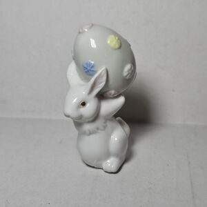 Porcelain Spring Easter Bunny Rabbit Figurine with a Decorated Egg